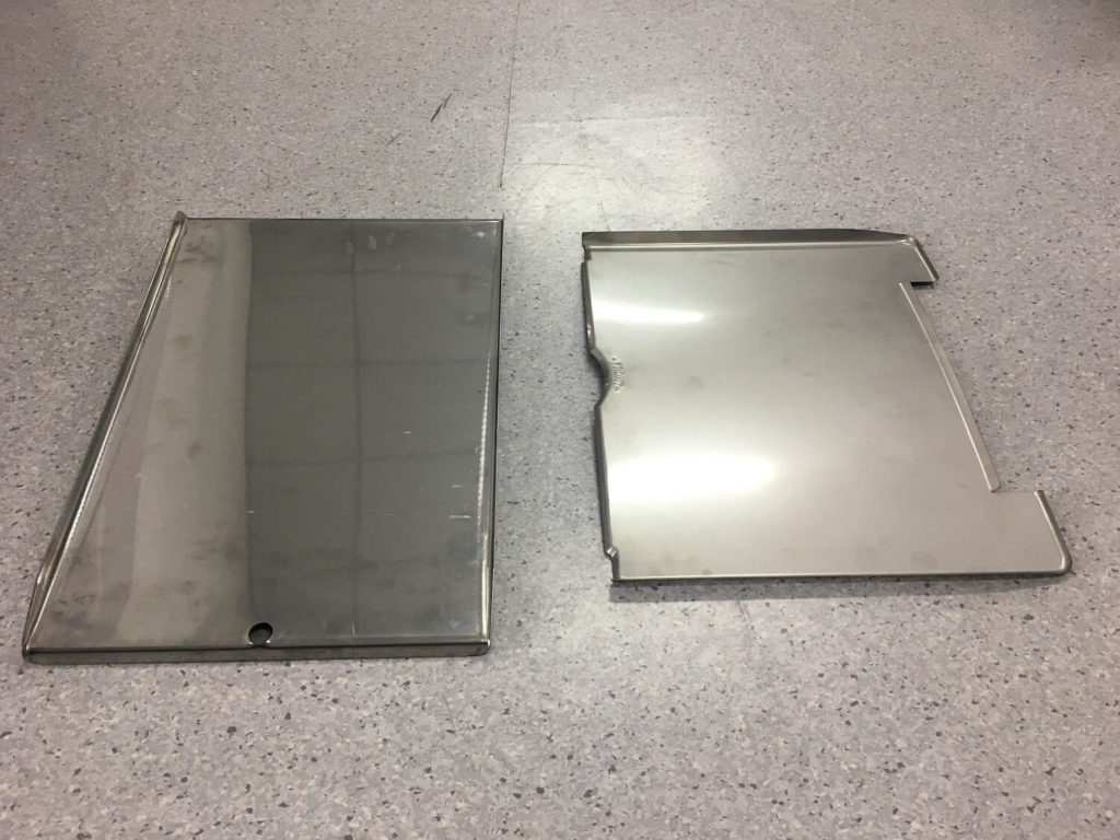 Grease tray comparison - thicker and heavier stainless steel GMG (left) vs galvanised steel Traeger (right).