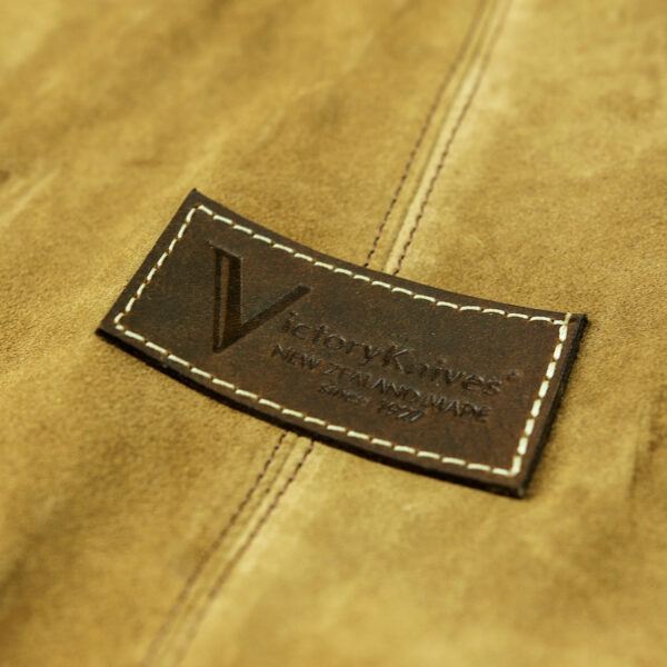 victory knives leather knife roll - close up of leather logo